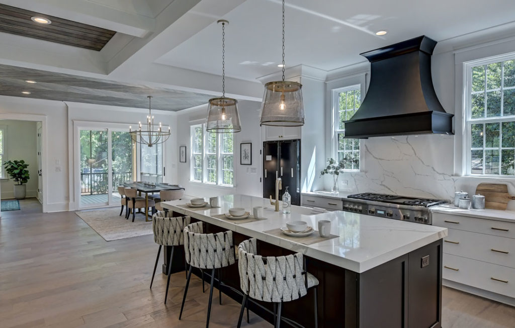 Luxury Chefs Kitchen by Barringer Homes Dark Cabinets